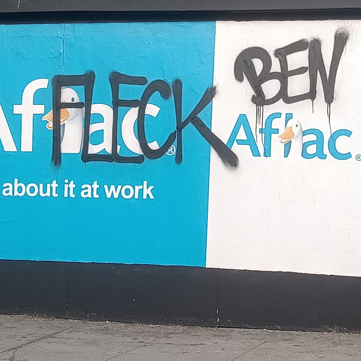 An Aflac billboard tagged so it reads Ben Affleck