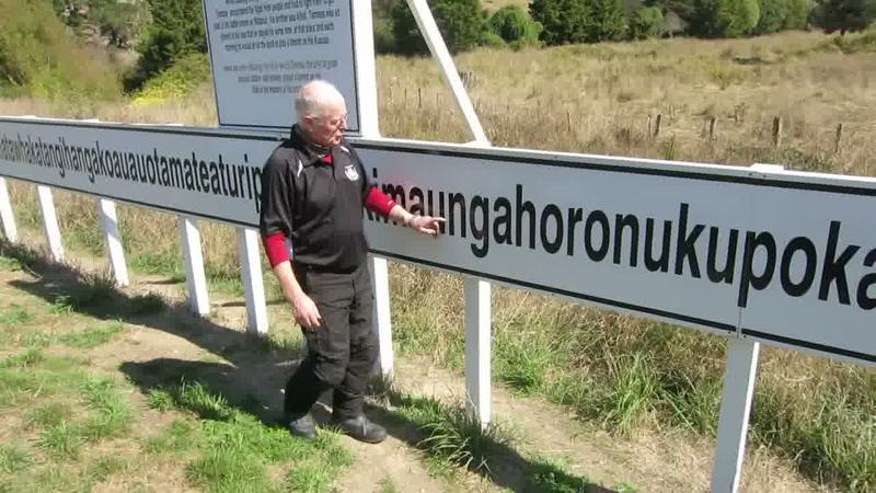 The pan continues past the middle of the sign